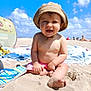baby, child, smiling, beach, sand, sunhat, shorts, blue_sky, clouds, towel, flip_flops, sunny, outdoor, summer, vacation, happy, cute, person, barefoot, sitting