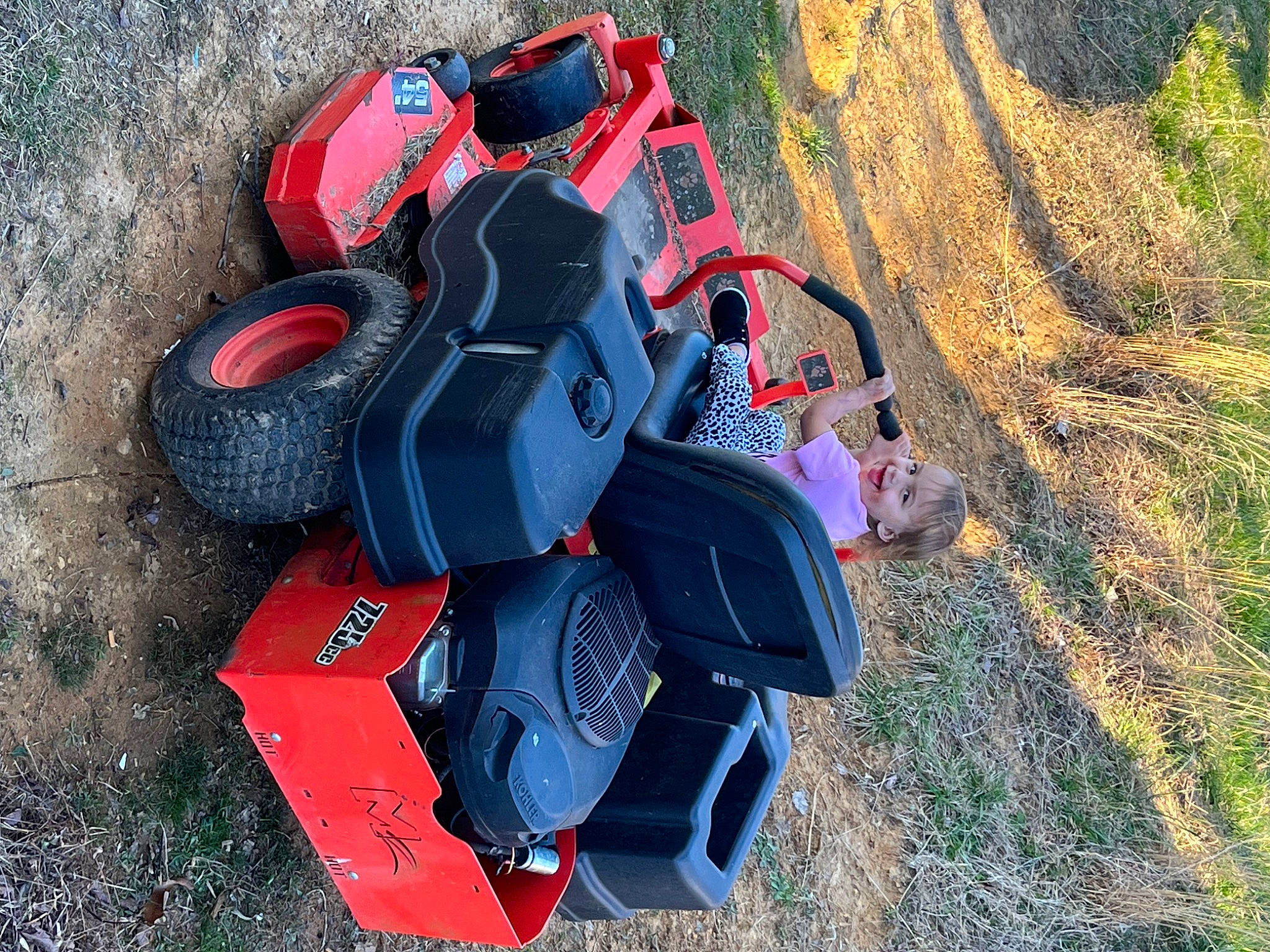 Ivie Reine is registered to the contest to win money with this photo: auto_part, automotive_design, automotive_exterior, automotive_tire, automotive_wheel_system, bumper, electric_blue, grass, joy, landscape, machine, motor_vehicle, person, personal_protective_equipment, plant, recreation, synthetic_rubber, tire, toy, tread