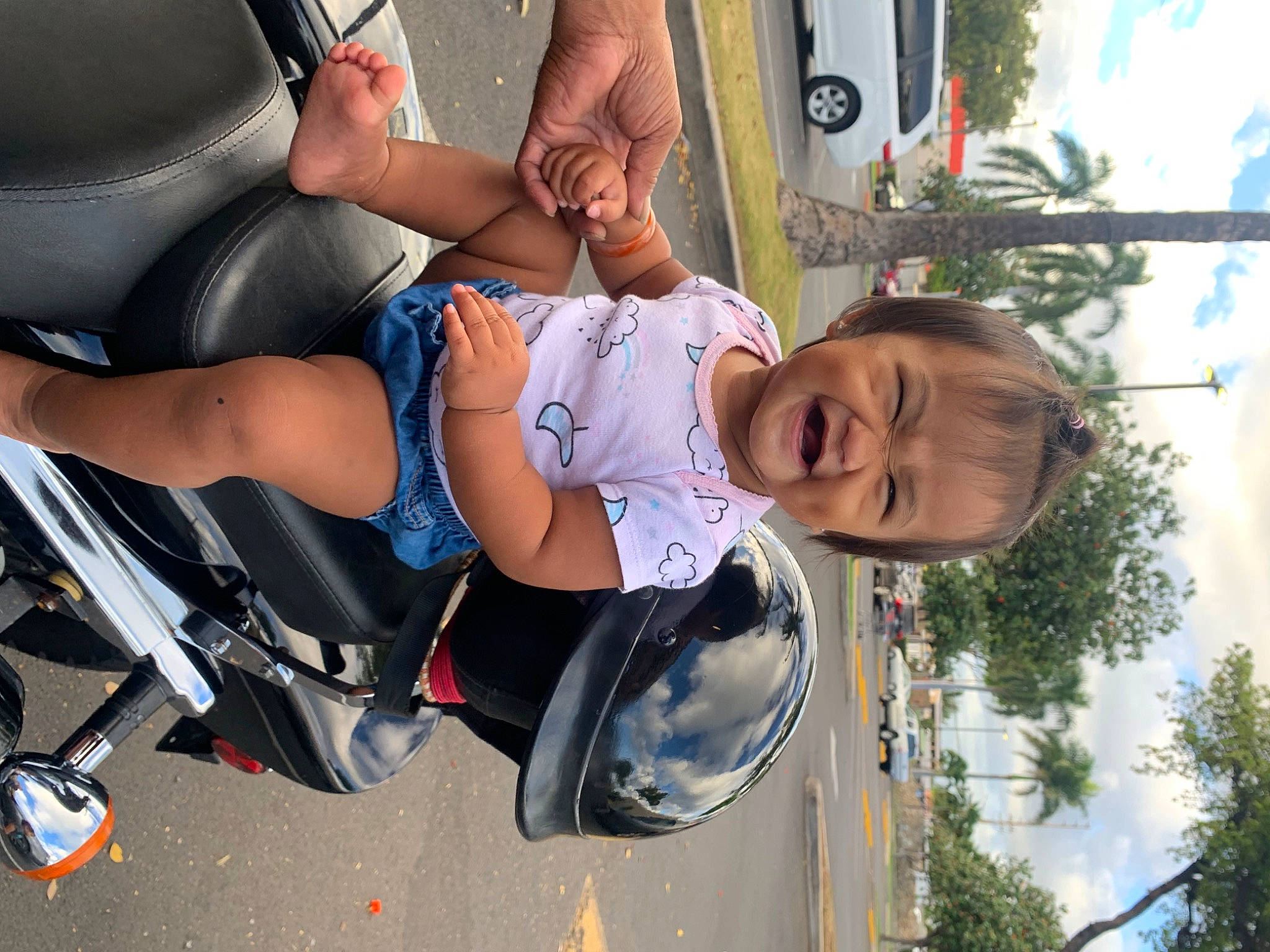 Dehnisty Rae joined the competition — help win amazing prizes! automotive_exterior, automotive_tire, automotive_wheel_system, fun, helmet, knee, leg, leisure, motor_vehicle, person, rim, shorts, sky, sneakers, sports_equipment, sports_gear, thigh, tire, tree, vehicle_door