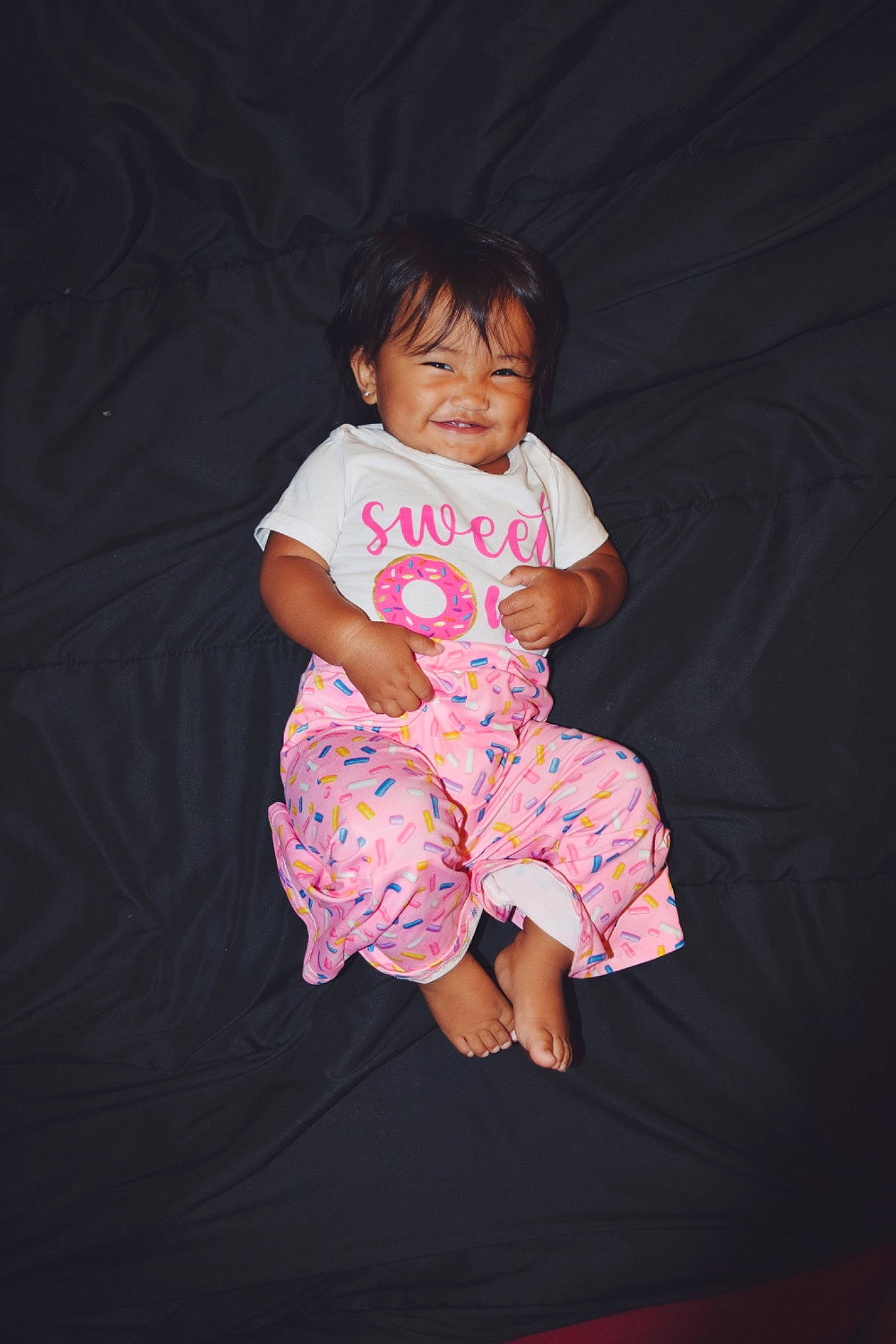 Dehnisty Rae joined the competition — help win amazing prizes! baby, baby_toddler_clothing, black_hair, cheek, child, darkness, dress, event, flash_photography, fun, happy, human_leg, joy, magenta, pattern, person, purple, sitting, sleeve, smile