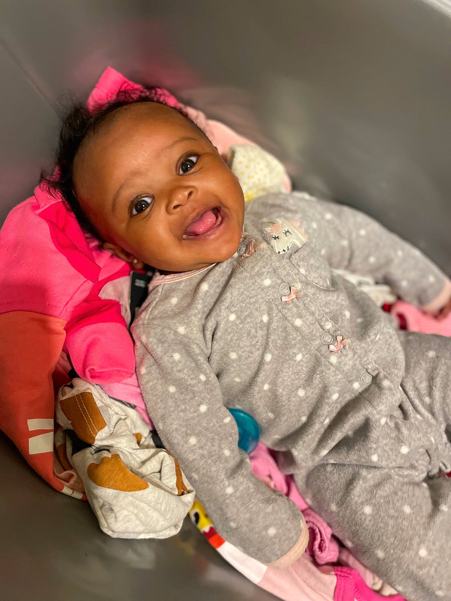 Harmony is registered to the contest to win money with this photo: baby, baby_toddler_clothing, cheek, child, doll, event, fun, happy, hat, jacket, magenta, nose, person, pink, play, sitting, sleeve, smile, textile, toddler