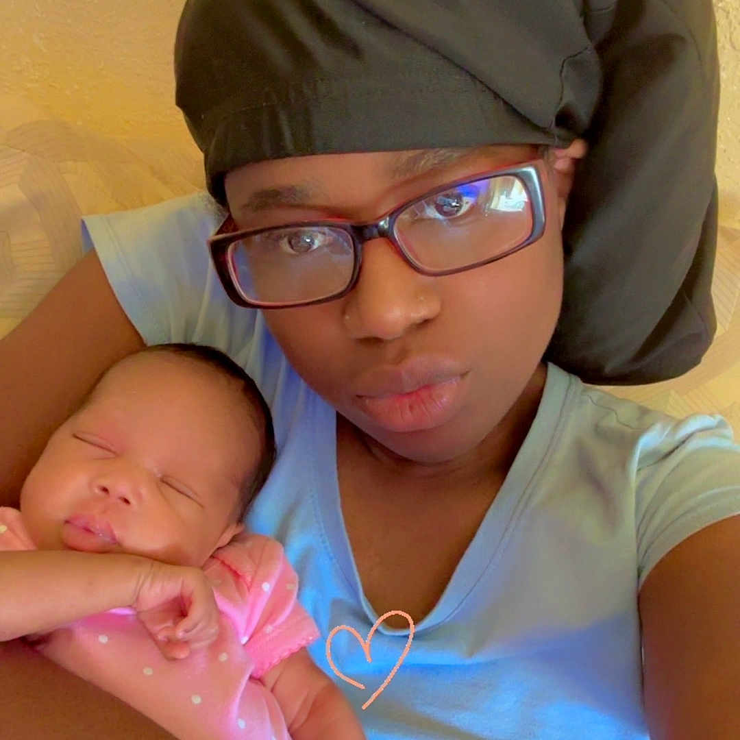 Autumn joined the competition — help win amazing prizes! affection, baby, blue_shirt, caring, closeup, face, family, glasses, headwrap, holding, indoor, love_heart, peaceful, person, pink_clothing, portrait, resting, skin, sleeping_baby, woman