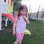 Ambre participe au concours pour gagner de l'argent avec cette photo : child, girl, playground, slide, trampoline, grass, backyard, fence, tree, pink_clothing, casual_shoes, play, outdoor, summer, daylight, pose, smile, fun, youth, person