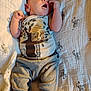 Joseph joined the competition — help win amazing prizes! baby, infant, sleeping, clothing, onesie, pants, blanket, zebra_pattern, hand, face, mouth_open, cute, child, newborn, lying_down, soft_lighting, indoors, peaceful, cozy, fabric