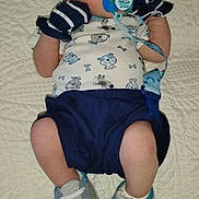 Joseph joined the competition — help win amazing prizes! baby, infant, pacifier, hat, mittens, blue_shoes, blanket, clothing, cute, sleepy, newborn, person, footwear, apparel, lying_down, indoors, child, soft_texture, patterned_shirt, accessory