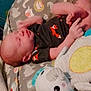 Joseph joined the competition — help win amazing prizes! baby, newborn, infant, onesie, fox_pattern, plush_toy, elephant, cushion, animal_print, sleeping, child, soft_toy, cute, indoors, resting, fabric, person, small, comfort, cozy