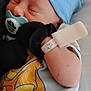Joseph is registered to the contest to win money with this photo: baby, newborn, sleeping, pacifier, blue_hat, onesie, hospital_bracelet, blanket, infant, cute, child, sleep, hand, soft, closeup, indoors, rest, peaceful, mittens, portrait