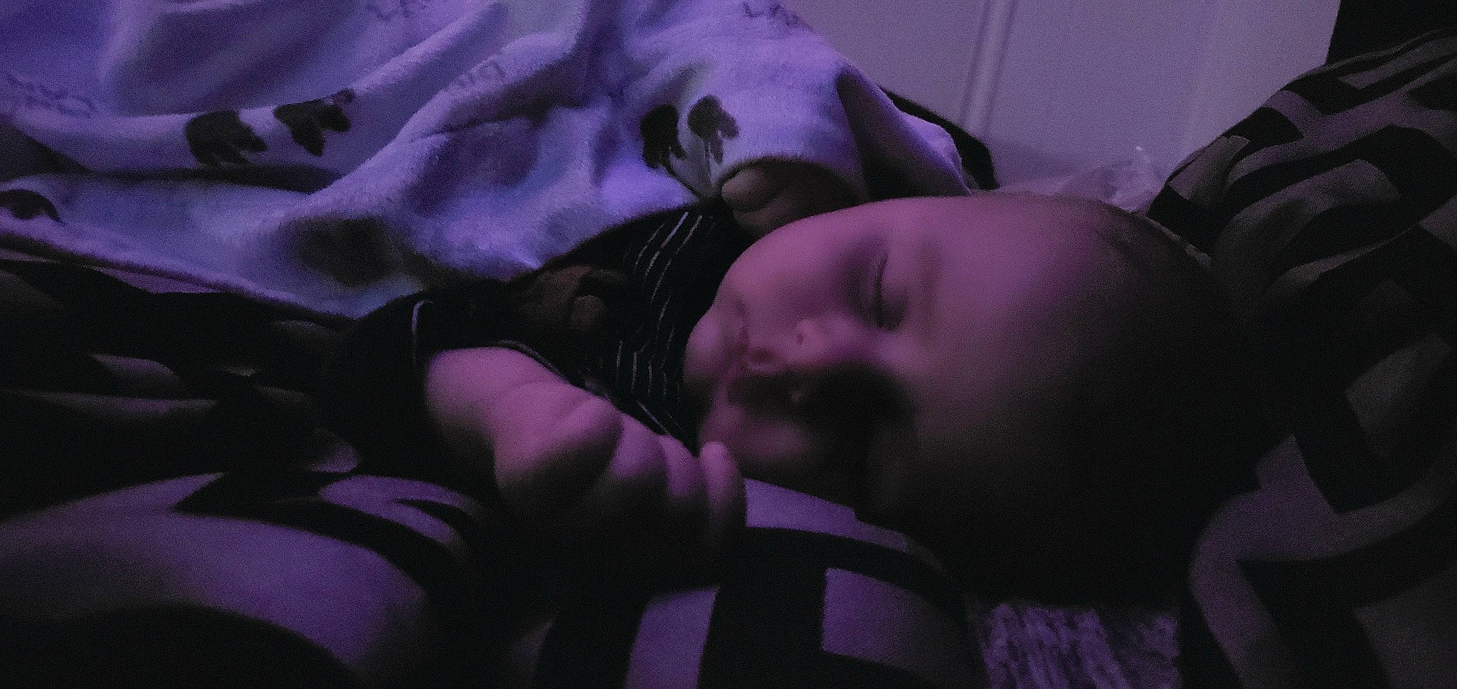 Clyde is registered to the contest to win money with this photo: black, black_hair, child, darkness, eye, flesh, hand, lip, mouth, muscle, nap, person, photography, purple, sleep, violet