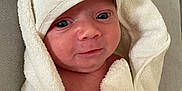 Elio participe au concours pour gagner de l'argent avec cette photo : baby, child, cozy, cute, expression, eyes, fabric, face, hand, hooded_towel, indoors, infant, newborn, person, portrait, skin, soft, towel, white, wrapped