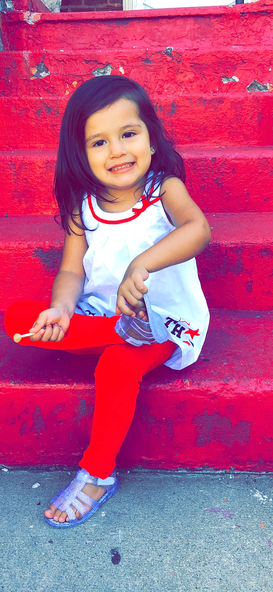 Nyeli is registered to the contest to win money with this photo: beauty, child, child_model, cool, day, facial_expression, fun, girl, happiness, infant, joy, leg, pattern, person, pink, play, red, sitting, skin, smile