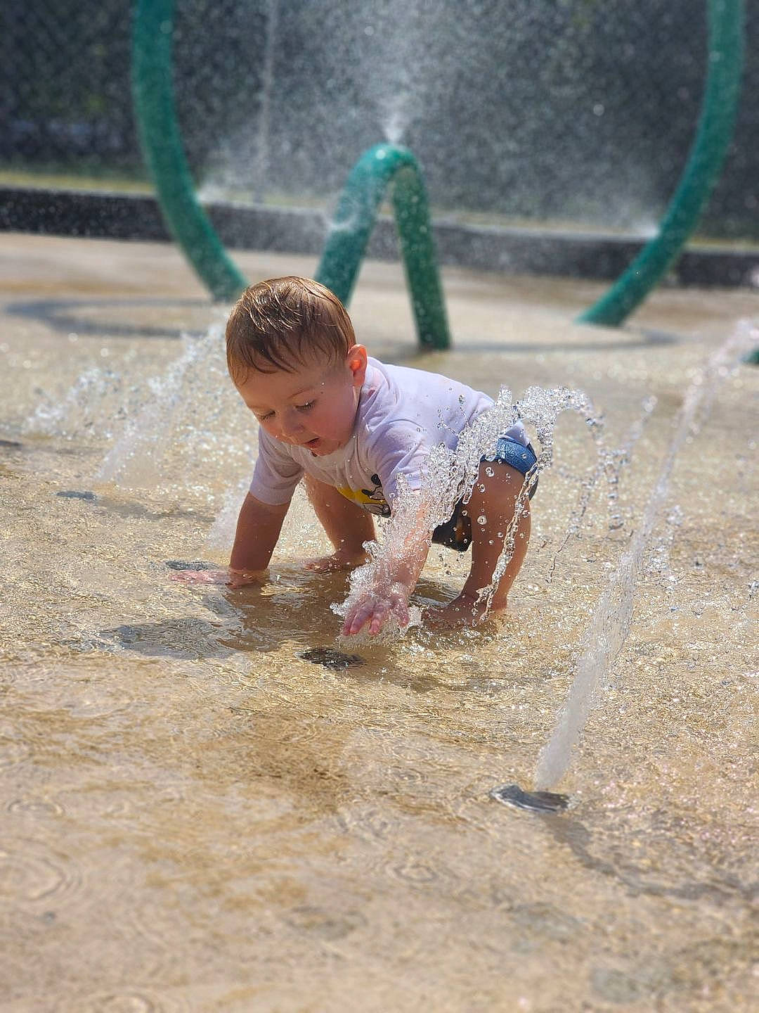 Layne is registered to the contest to win money with this photo: baby, barefoot, beach, child, city, foot, fun, grass, happy, leisure, person, play, playground, recreation, sand, shorts, sitting, soil, swing, toddler