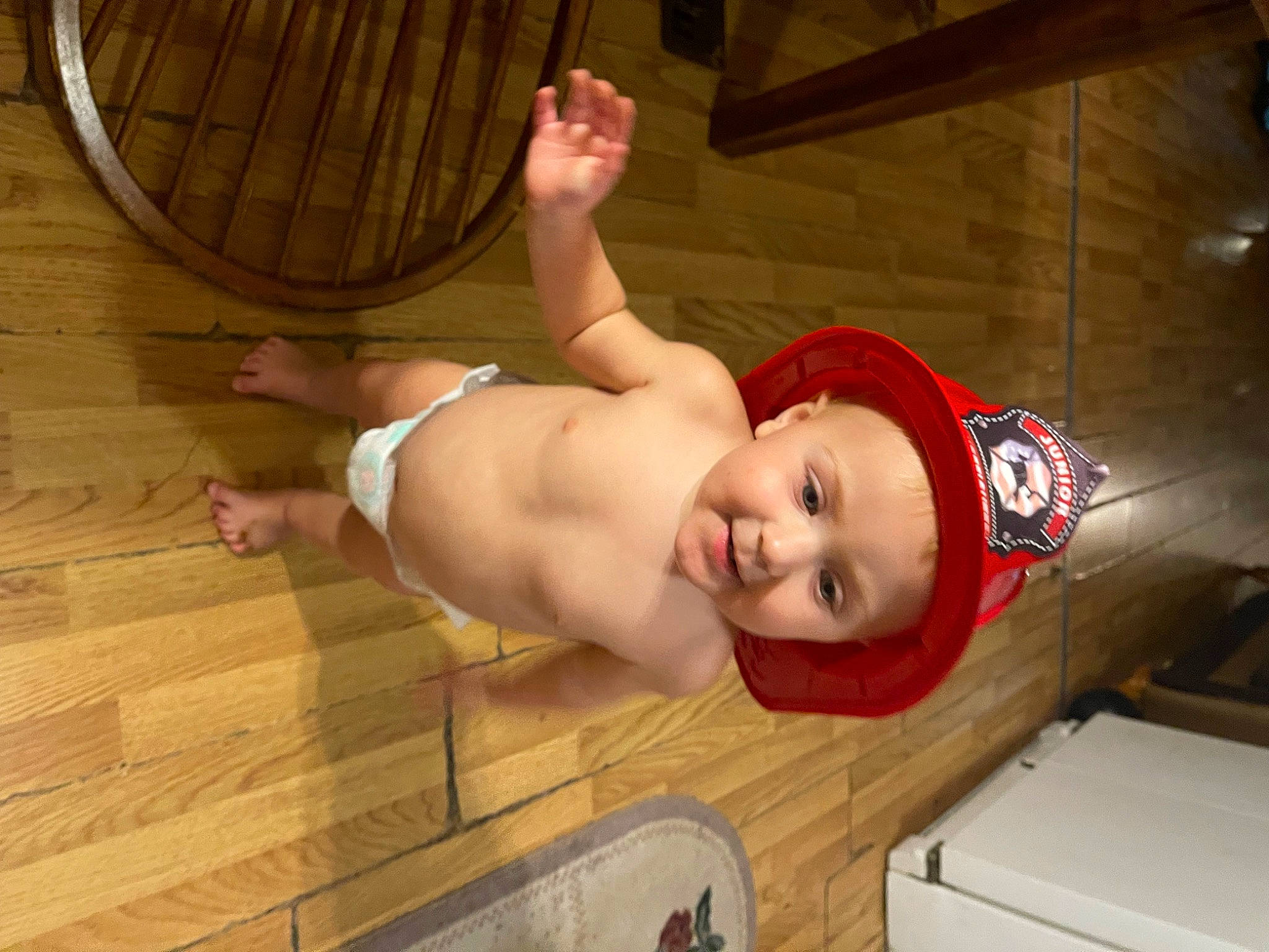 Layne is registered to the contest to win money with this photo: abdomen, baby, chest, child, comfort, elbow, flesh, flooring, foot, fun, hardwood, headwear, human_leg, knee, leg, navel, person, stomach, thigh, trunk