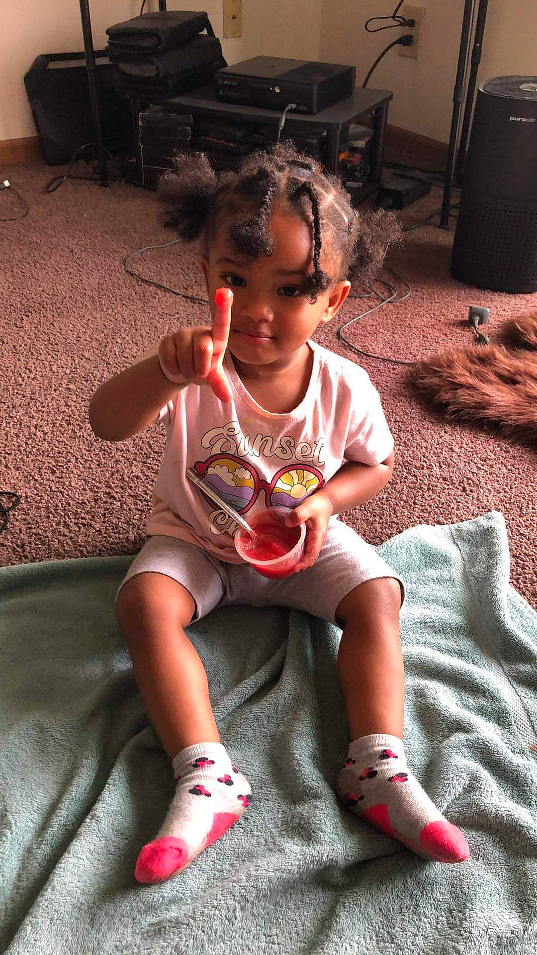 Zhavia is registered to the contest to win money with this photo: baby_toddler_clothing, carmine, child, comfort, finger, flooring, fun, hairstyle, happy, head, human_leg, knee, lap, leisure, living_room, person, room, sitting, thigh, toddler