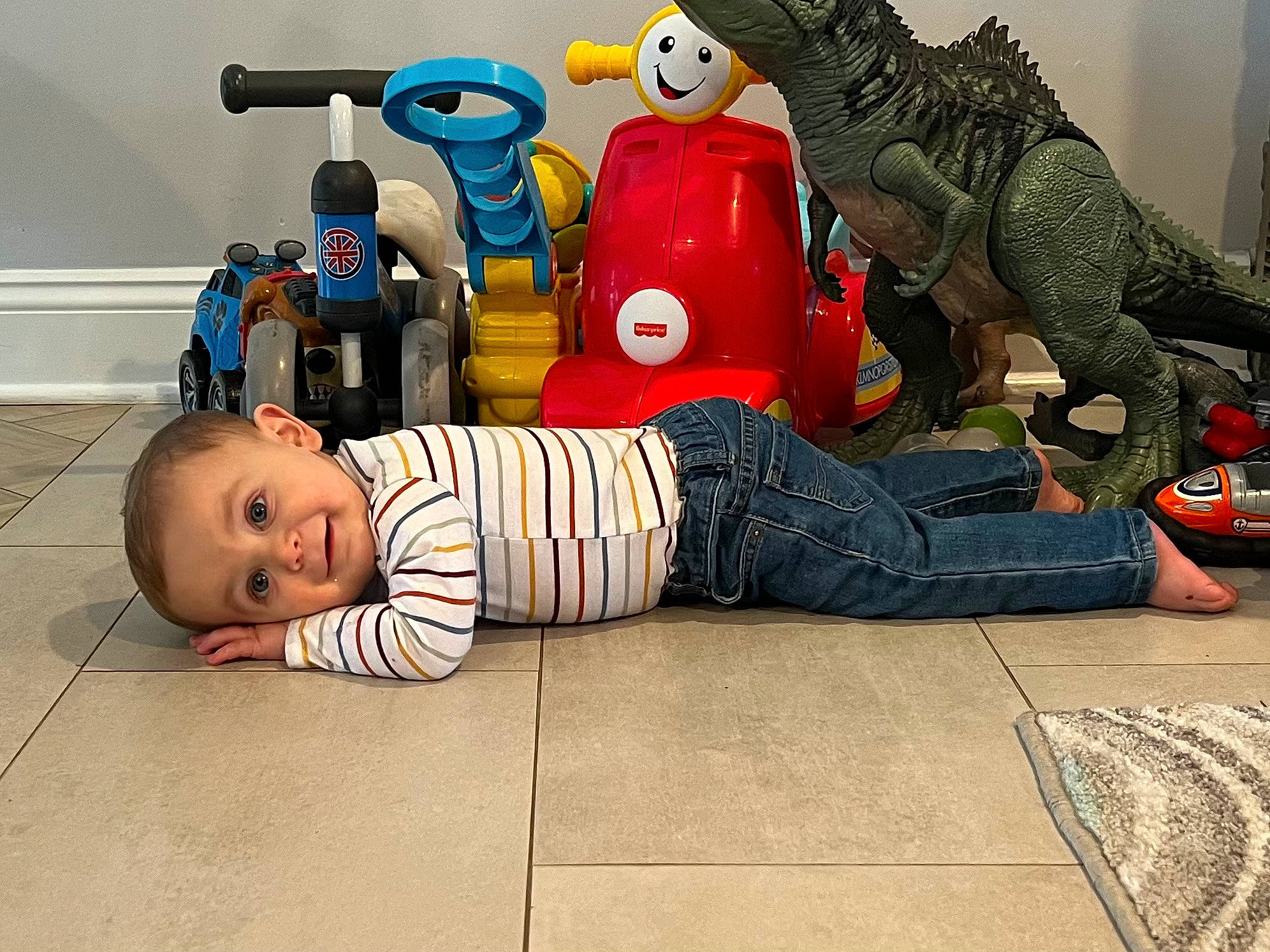 Hunter is registered to the contest to win money with this photo: action_figure, animation, baby, baby_products, baby_toddler_clothing, carmine, child, comfort, fictional_character, flooring, fun, person, play, reptile, room, sitting, smile, stuffed_toy, terrestrial_animal, toddler