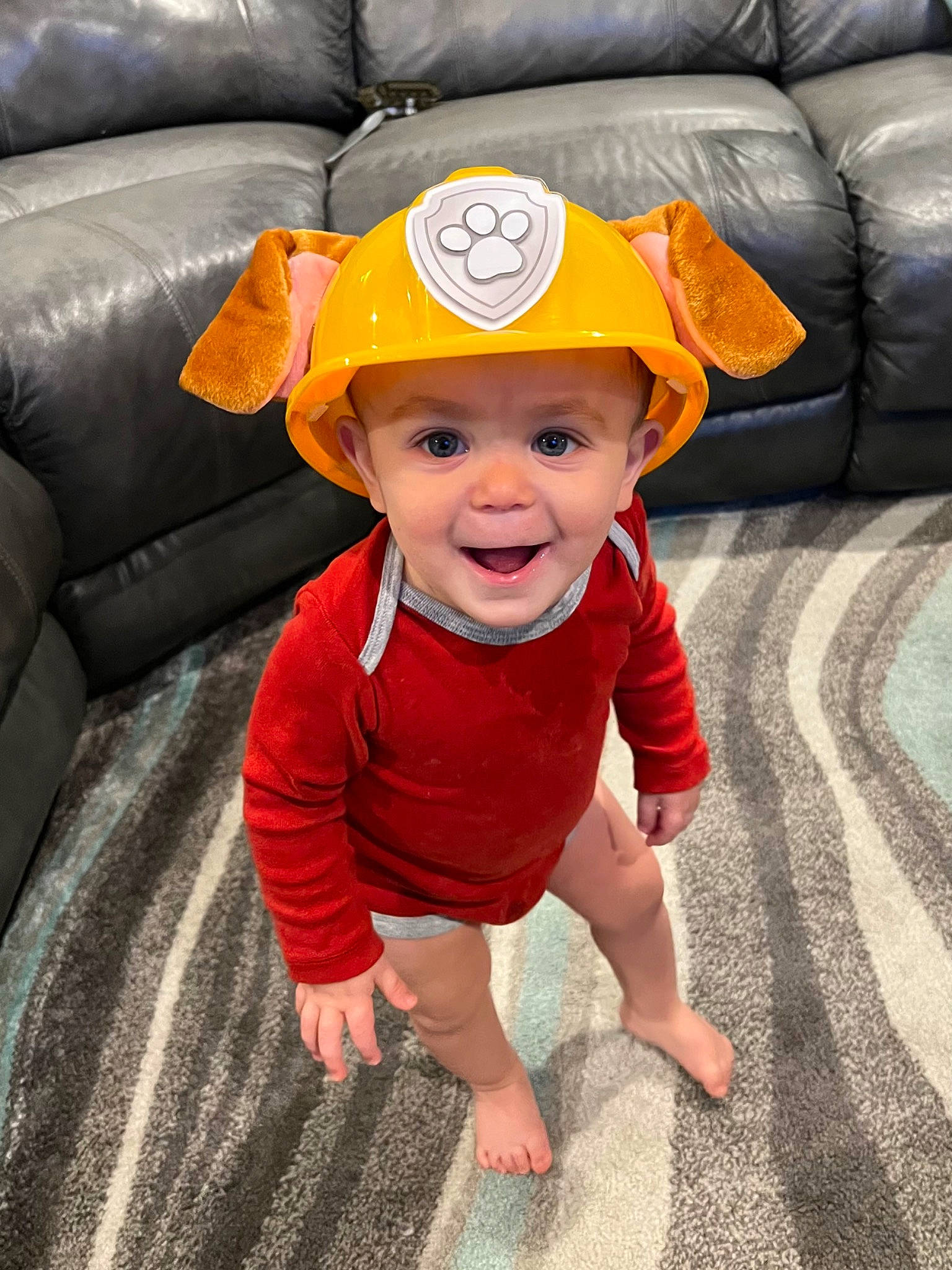 Hunter is registered to the contest to win money with this photo: baby, baby_toddler_clothing, cap, child, comfort, costume_hat, couch, flooring, fun, grass, happy, hat, head, headgear, headwear, joy, orange, person, play, sleeve