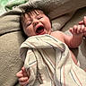 Scarlett is registered to the contest to win money with this photo: baby, towel, blanket, smile, laughing, hand, infant, child, skin, person, happy, face, bed, cozy, cute, nap, indoor, soft, comfort, expression