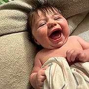 Scarlett joined the competition — help win amazing prizes! baby, laughing, blanket, happy, child, infant, cute, smiling, face, hair, skin, hand, cozy, soft, texture, indoors, portrait, joyful, expression, wrapped
