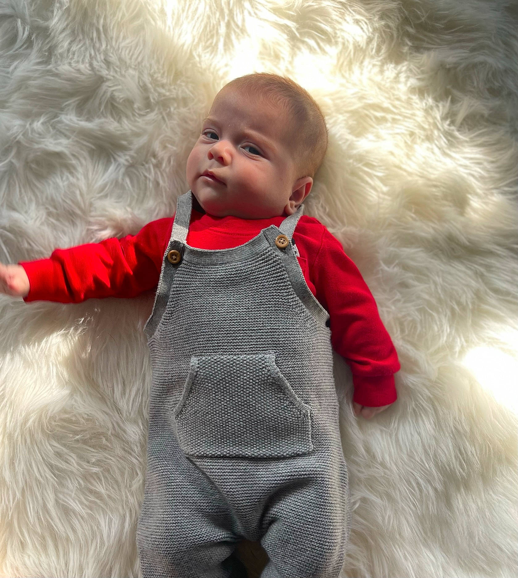 Layton is registered to the contest to win money with this photo: baby, baby_toddler_clothing, cheek, child, clothing, comfort, eye, fur, fur_clothing, gesture, happy, head, hood, jacket, outerwear, person, sitting, skin, sleeve, textile