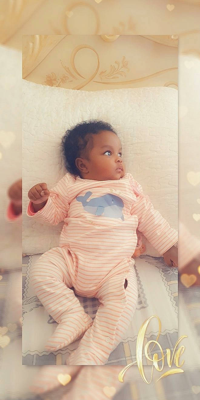 Aliya participe au concours pour gagner de l'argent avec cette photo : abdomen, baby, baby_products, baby_sleeping, baby_toddler_clothing, bedding, child, comfort, happy, human_leg, knee, linens, peach, person, pink, room, sitting, sleeve, thigh, toddler