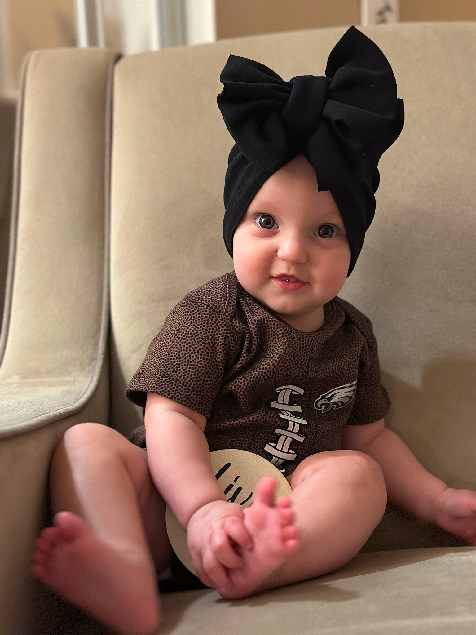 Aspyn joined the competition — help win amazing prizes! baby, baby_toddler_clothing, cheek, child, chin, comfort, face, facial_expression, foot, head, headwear, human_body, human_leg, knee, neck, person, sitting, skin, sleeve, smile
