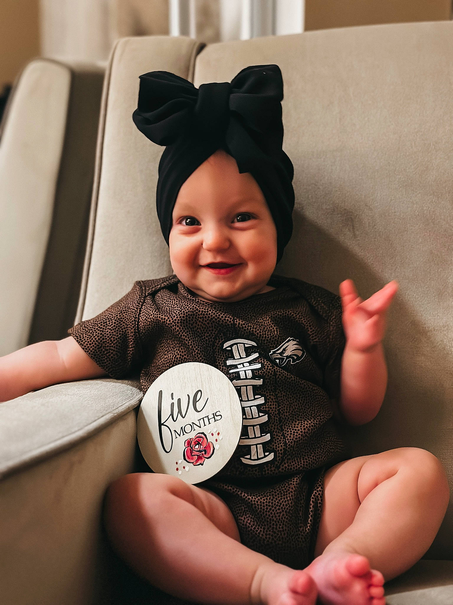 Aspyn is registered to the contest to win money with this photo: baby, baby_toddler_clothing, child, comfort, eye, facial_expression, finger, fun, hairstyle, happy, head, headgear, headwear, human_body, joy, person, product, skin, sleeve, smile