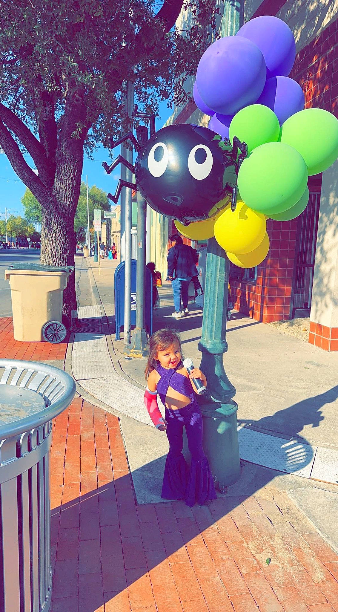 Sophia Rose is registered to the contest to win money with this photo: animated_cartoon, animation, balloon, city, electric_blue, fun, games, happy, leisure, magenta, party_supply, person, plant, recreation, sky, toddler, tourism, travel, tree, vacation