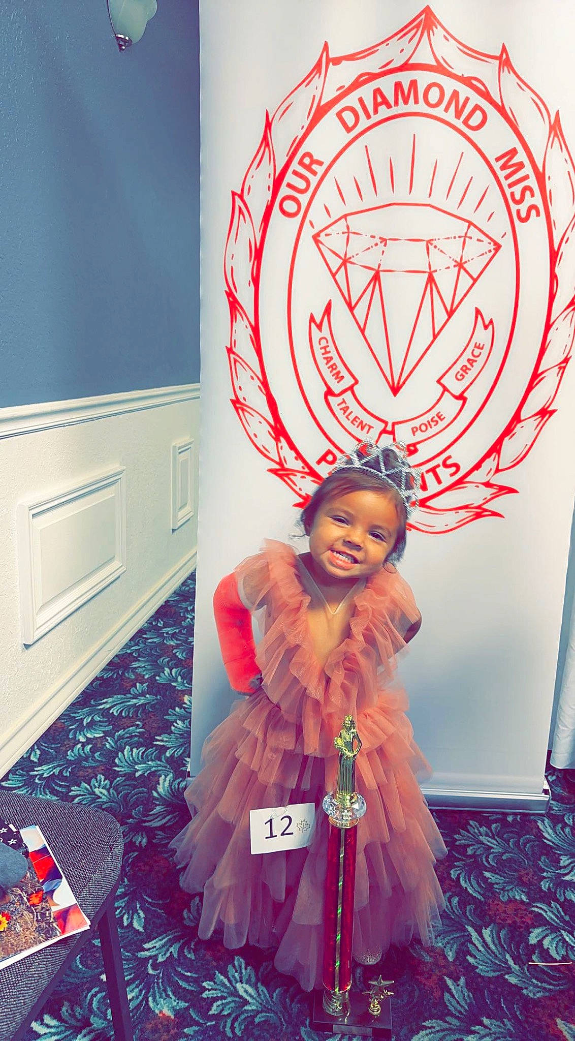 Sophia Rose is registered to the contest to win money with this photo: art, cabinetry, cool, design, electric_blue, event, fashion_accessory, fashion_design, flooring, font, fun, happy, illustration, joy, magenta, orange, pattern, person, photograph, smile