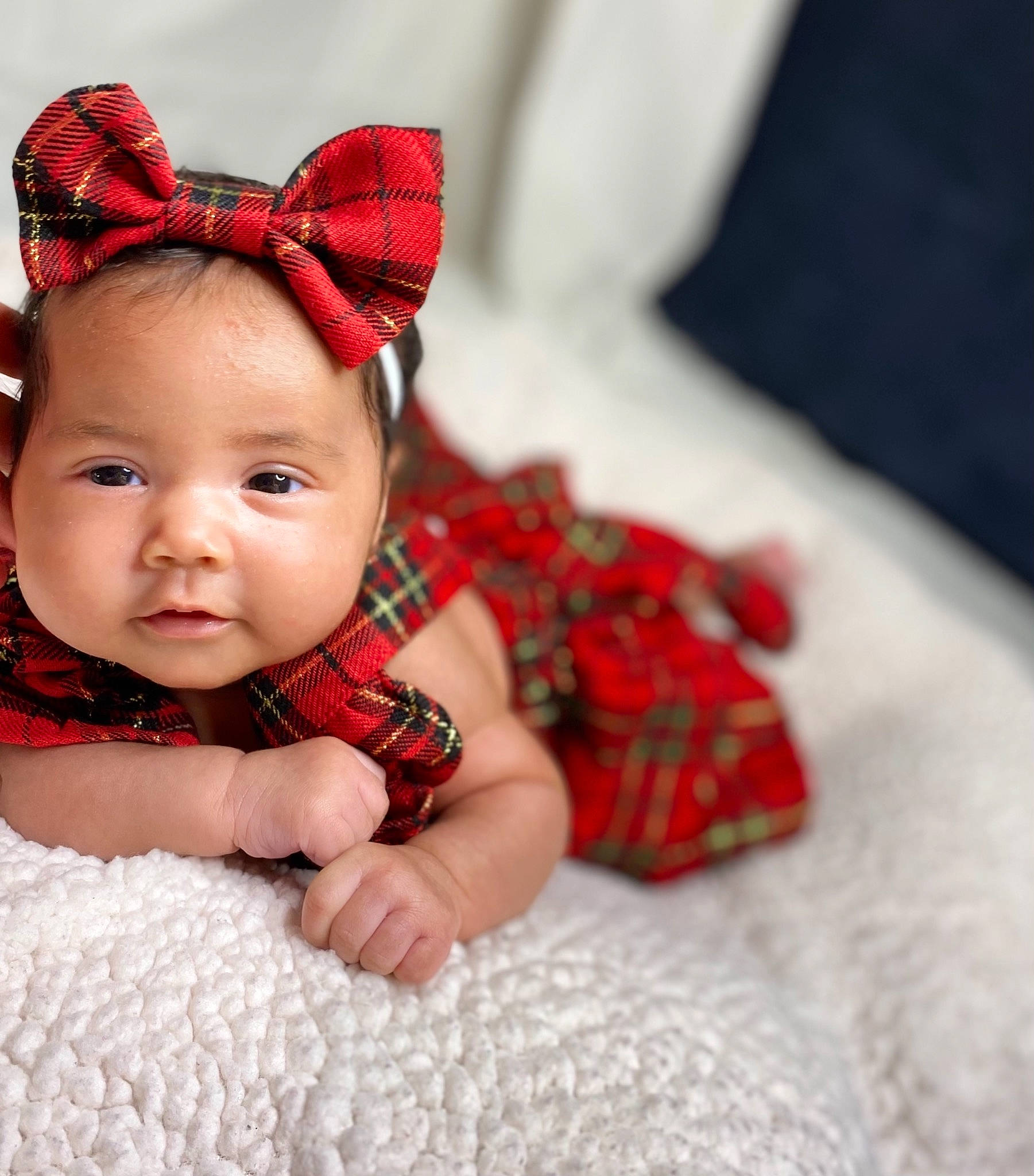 Delylah is registered to the contest to win money with this photo: baby, baby_toddler_clothing, cheek, child, costume, costume_accessory, costume_hat, fashion_accessory, hair_accessory, headgear, headpiece, linens, lip, nose, pattern, person, plaid, red, tartan, textile