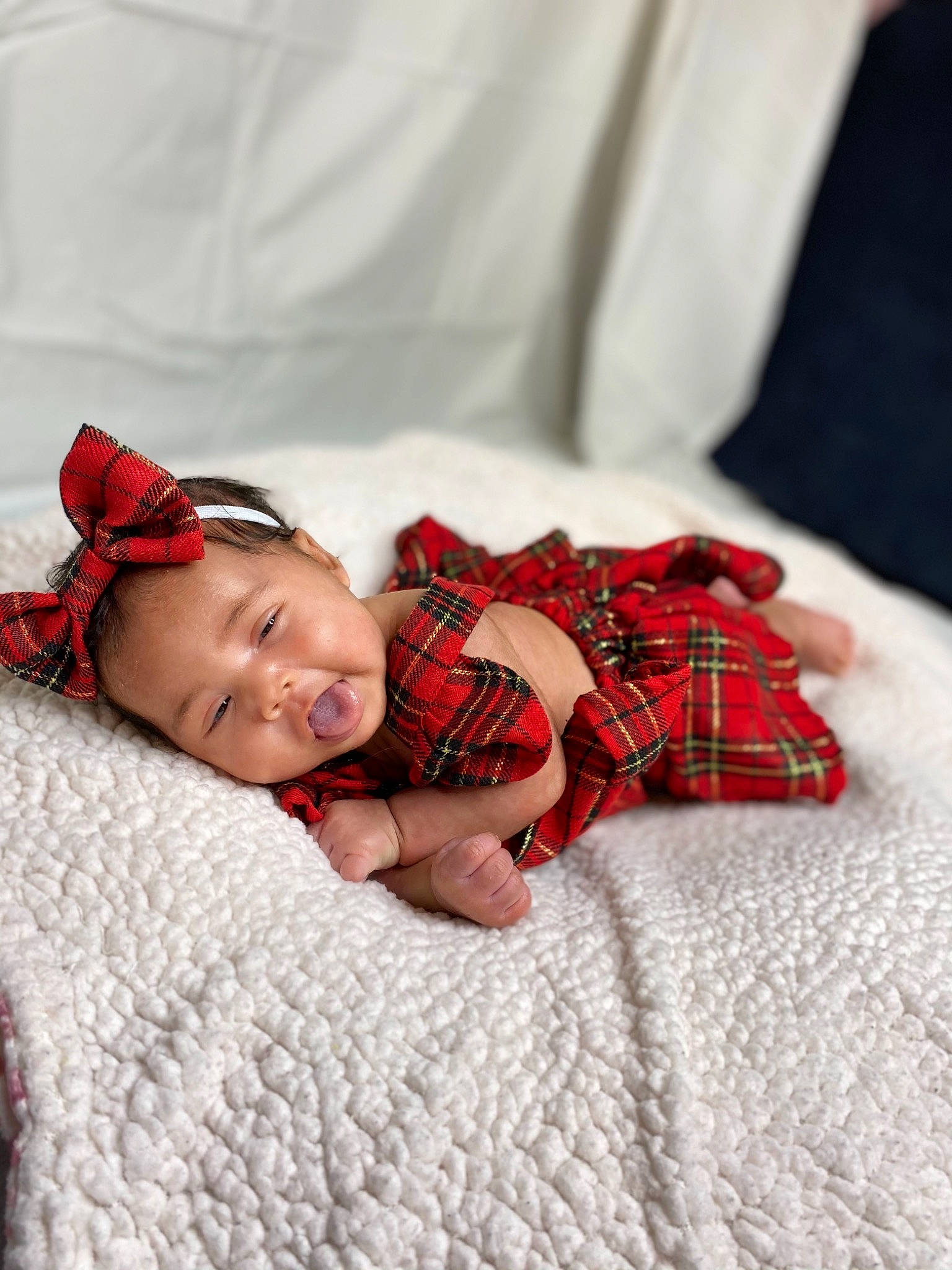 Delylah joined the competition — help win amazing prizes! baby, baby_toddler_clothing, bed_sheet, bedding, blanket, bonnet, carmine, child, comfort, headband, linens, lip, pattern, person, plaid, portrait_photography, red, tartan, textile