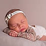 Léna participe au concours pour gagner de l'argent avec cette photo : baby, child, closeup, cute, delicate, face, flower, hands, headband, infant, lace, newborn, pastel, peaceful, portrait, resting, skin, sleeping, soft, young
