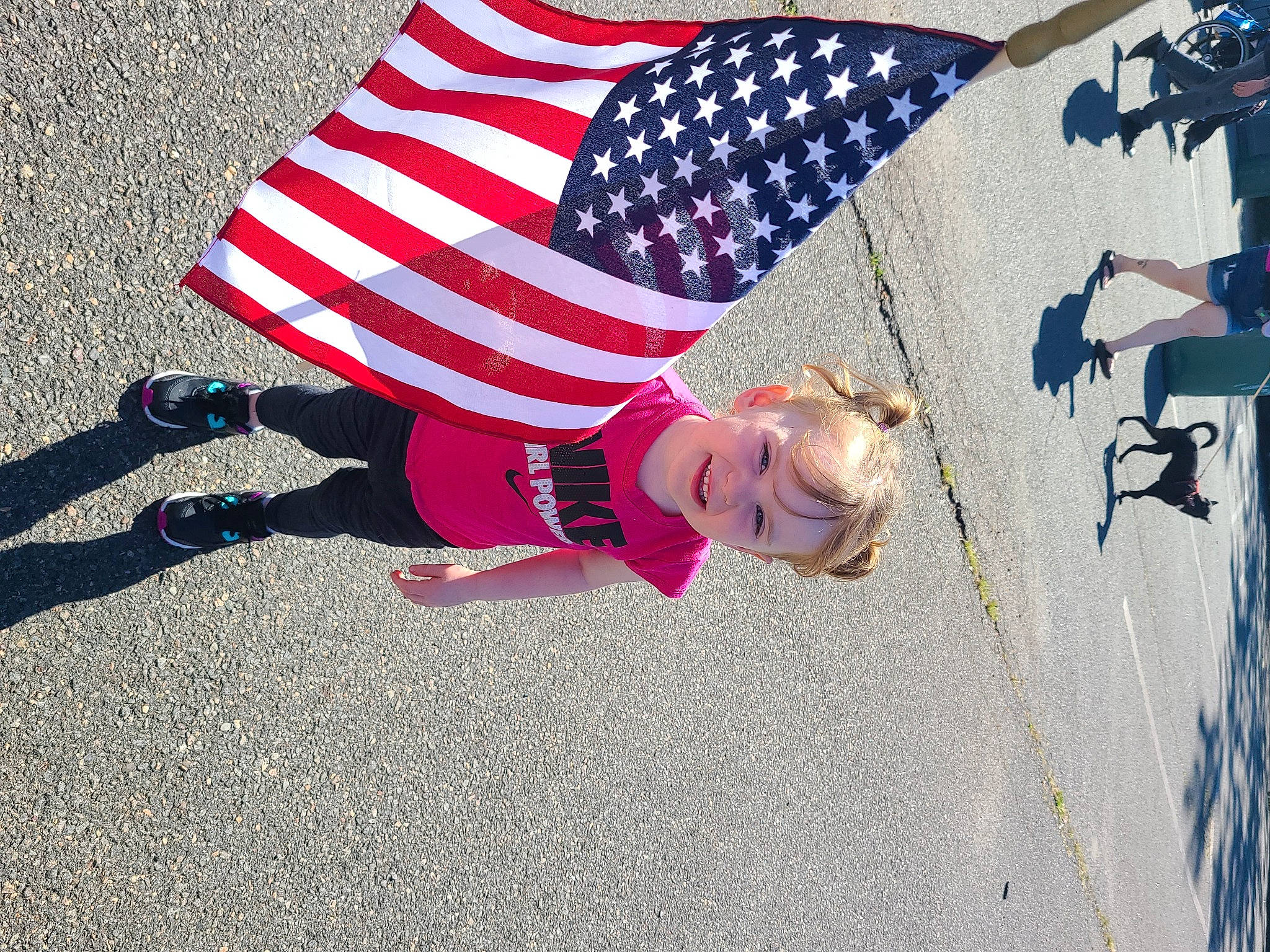 Davina joined the competition — help win amazing prizes! asphalt, carmine, electric_blue, event, flag, flag_day_usa, flag_of_the_united_states, fun, grass, hat, holiday, joy, pattern, person, public_event, road, road_surface, shadow, sidewalk, sunglasses