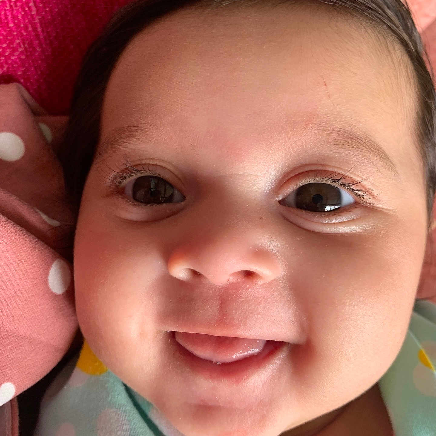 Anelis is registered to the contest to win money with this photo: baby, babylaughing, bodypart, clothing, cushion, dress, face, happy, hat, head, homedecor, laughing, mouth, newborn, person, photography, portrait, selfie, smile, teeth