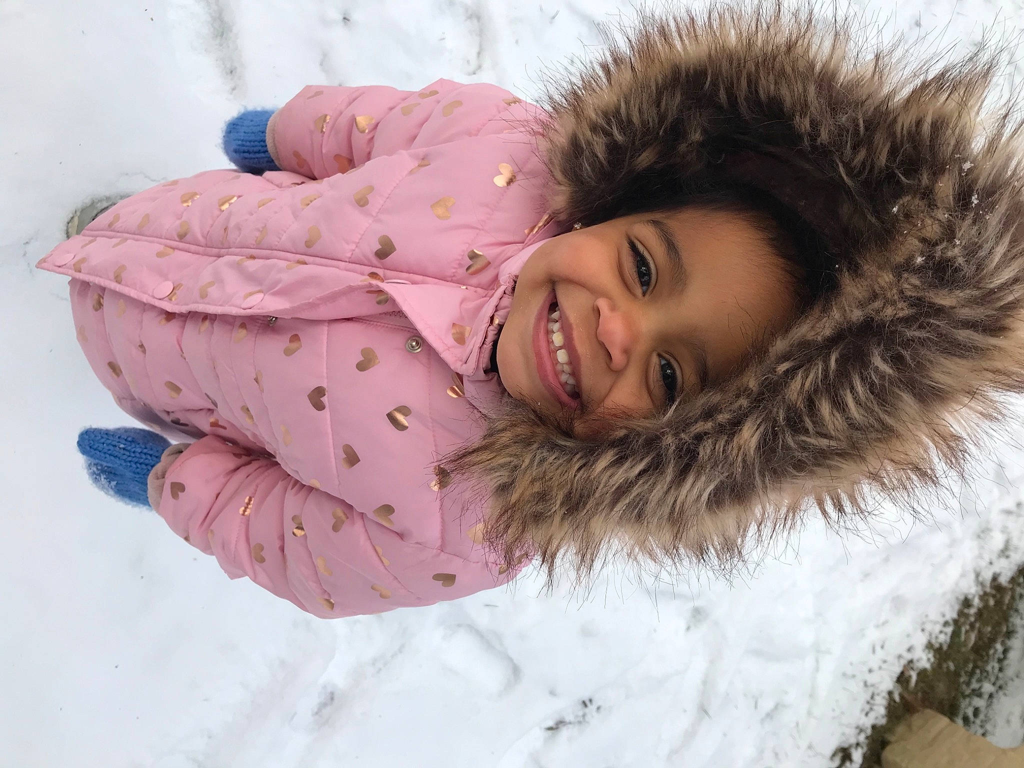 Illauni is registered to the contest to win money with this photo: eye, face, facial_expression, flash_photography, freezing, fun, fur_clothing, grass, hair, happy, head, headgear, human_body, jacket, joy, outerwear, parka, person, skin, smile