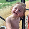 child, toddler, smiling, happy, shirtless, hair, hand, face, outdoor, grass, truck, rusty, window, glass, dirt, dirt_road, vehicle, nature, daylight, portrait