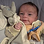 Tyano participe au concours pour gagner de l'argent avec cette photo : baby, infant, blanket, plush_toy, elephant, pacifier, pacifier_clip, clothing, face, head, smile, hand, cozy, soft, seated, fabric, cute, child, comfort, indoor