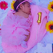 Antonella joined the competition — help win amazing prizes! baby, sleeping, newborn, child, portrait, pink, flower_crown, headband, tutu, dress, blanket, plush_blanket, birthday, number_one, balloon, sunflowers, pacifier, diaper, outdoor, grass