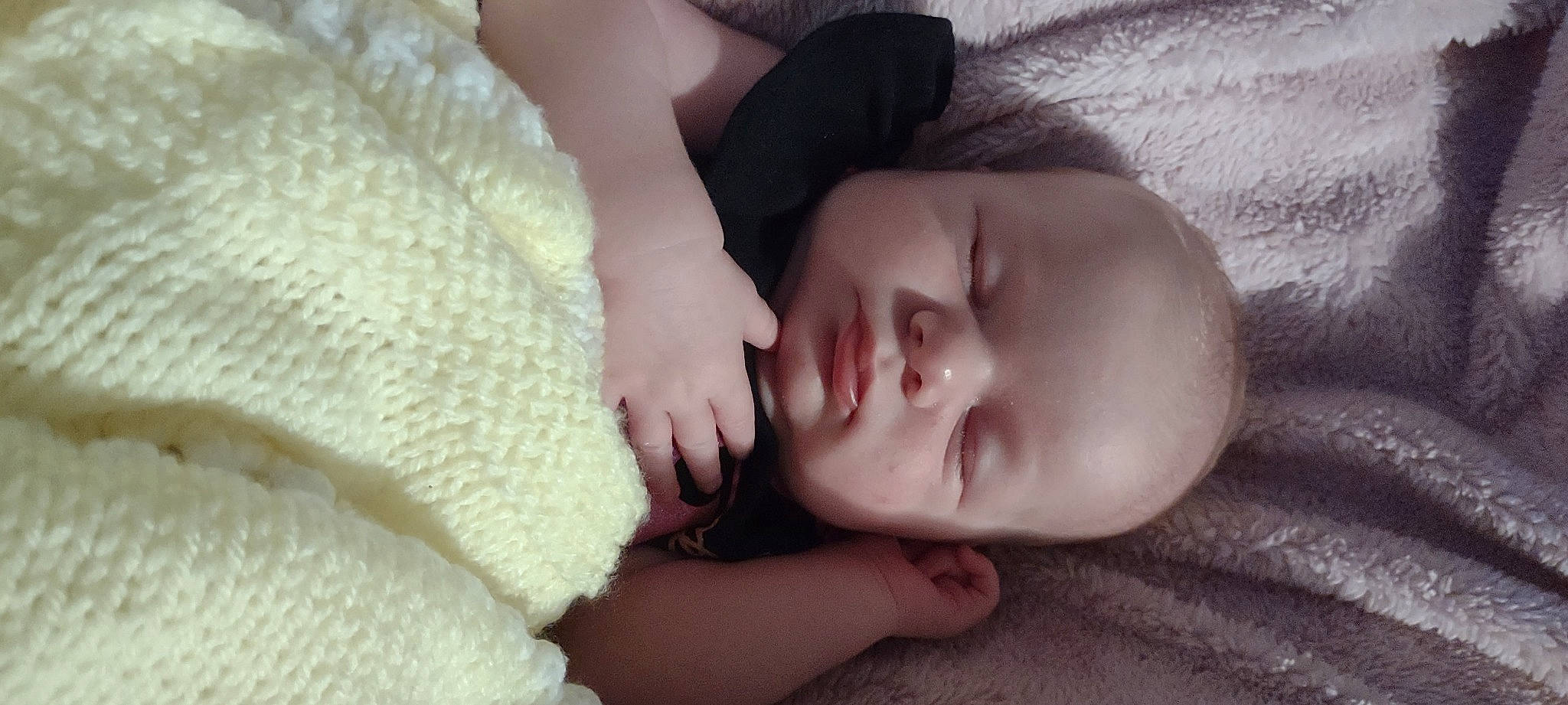 Lilly is registered to the contest to win money with this photo: arm, baby, baby_toddler_clothing, cheek, chin, comfort, ear, eye, eyebrow, face, finger, hair, head, human_body, iris, lip, mouth, nose, person, skin