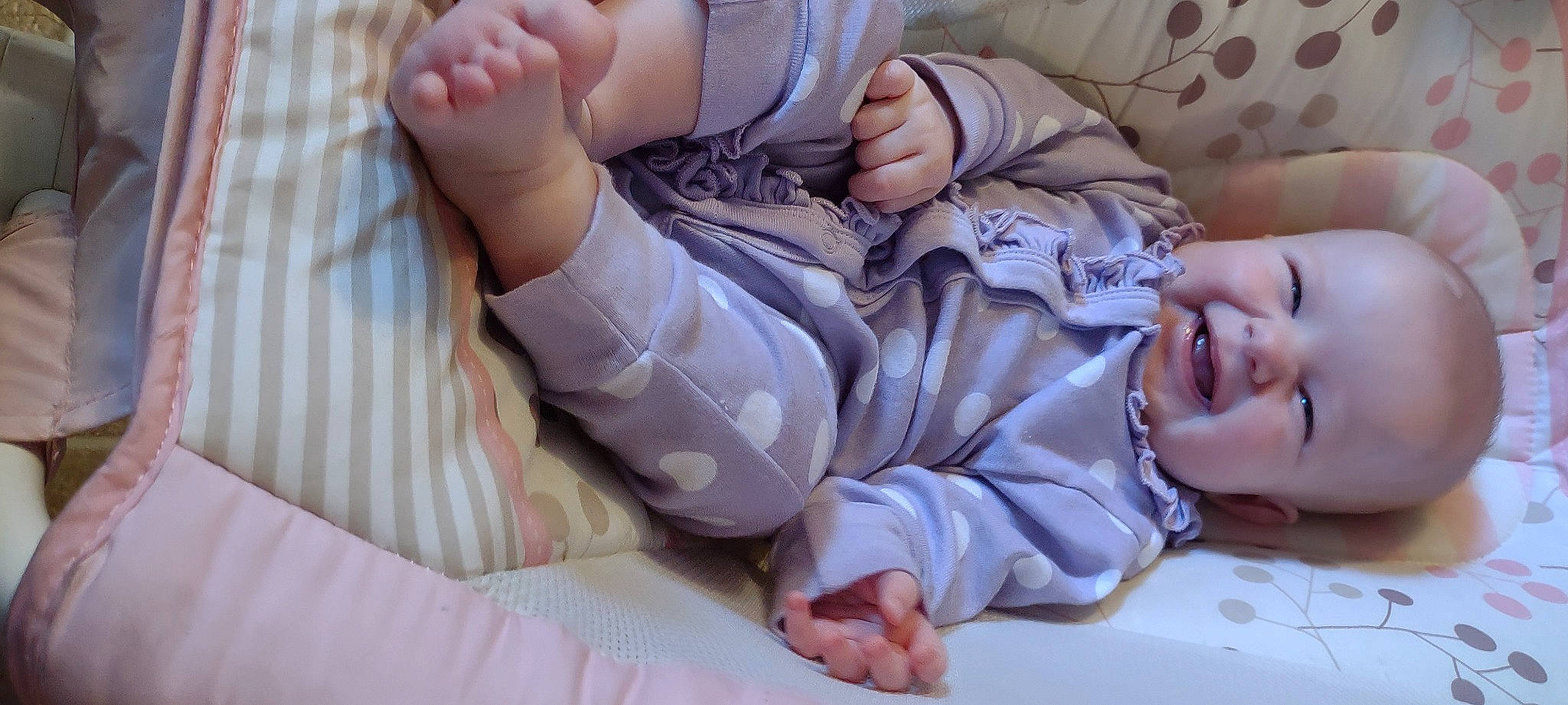 Lilly is registered to the contest to win money with this photo: baby, baby_toddler_clothing, child, comfort, finger, foot, gesture, human_leg, joint, knee, leg, nail, pattern, person, sitting, skin, thigh, thumb, toddler, white