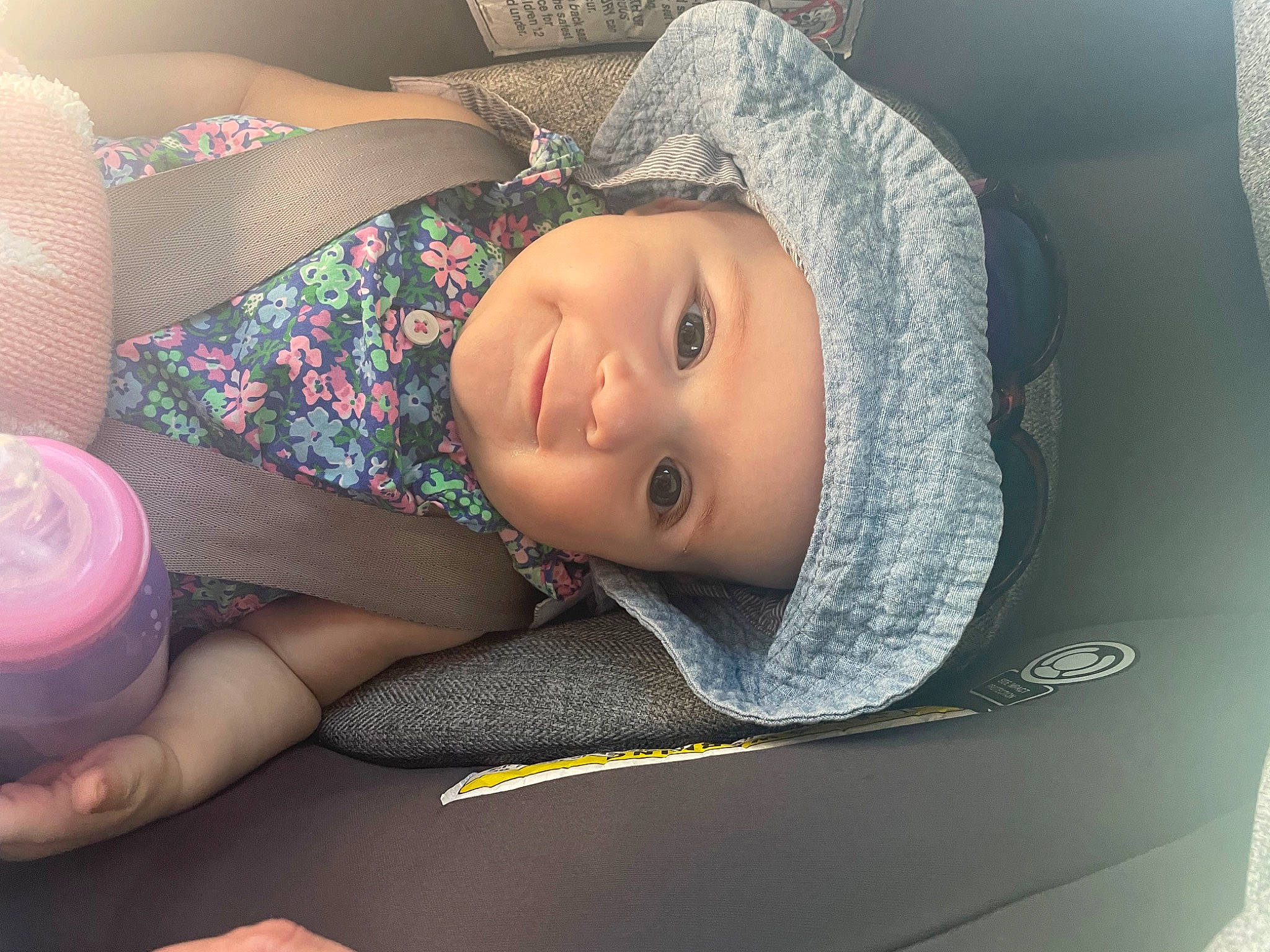 Kartier is registered to the contest to win money with this photo: auto_part, baby, car_seat, comfort, eye, eyebrow, eyelash, finger, headgear, headwear, human_leg, joy, linens, lip, mouth, nail, nose, person, skin, thigh