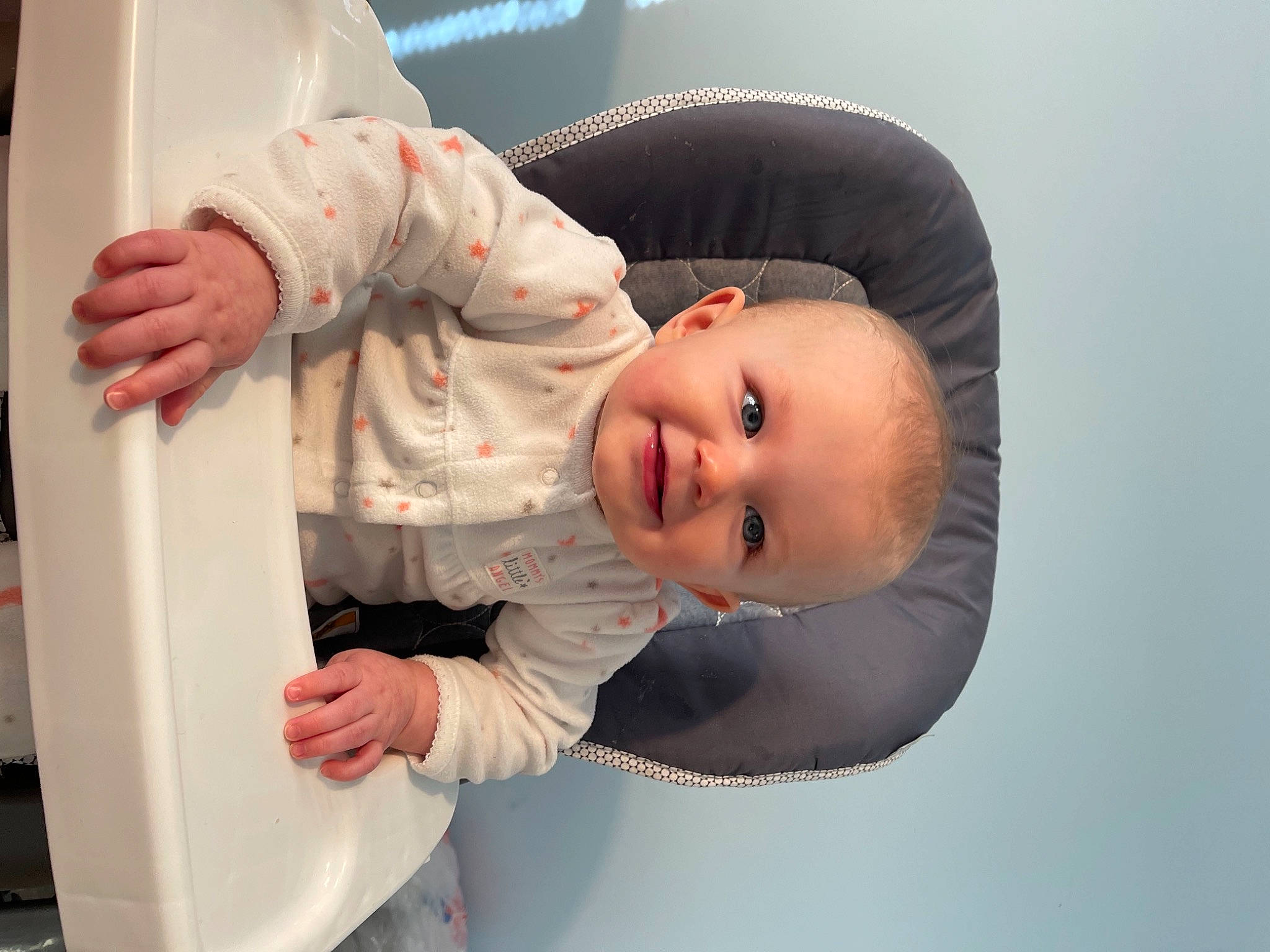 Carolyn is registered to the contest to win money with this photo: baby, baby_products, baby_toddler_clothing, cheek, child, comfort, finger, flash_photography, gesture, happy, joy, outerwear, person, portrait_photography, room, sitting, skin, sleeve, smile, thumb