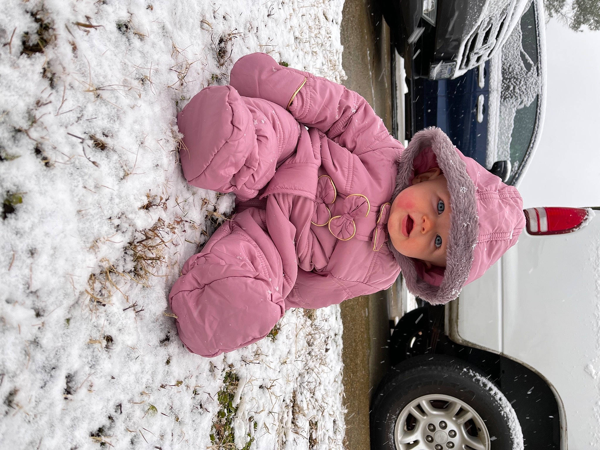 Carolyn joined the competition — help win amazing prizes! automotive_tire, car, freezing, fun, glove, hat, headwear, helmet, jacket, magenta, person, pink, plant, recreation, snow, tire, toddler, tree, vehicle, vehicle_door