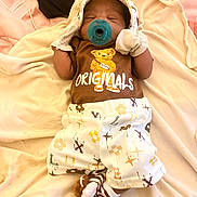 Noah is registered to the contest to win money with this photo: baby, newborn, pacifier, blanket, clothing, cute, sleeping, infant, soft, teddy_bear, socks, person, lying_down, indoors, comfort, small, adorable, resting, child, cute_outfit