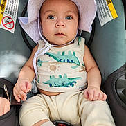 Levi joined the competition — help win amazing prizes! baby, child, infant, car_seat, hat, sunhat, dinosaur_print, tank_top, cream_pants, socks, hands, face, eyes, cute, indoors, seatbelt, clothing, portrait, baby_clothing, car_interior