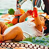 baby, infant, child, playmat, toy, turtle, colorful, patterned, curly_hair, reaching, lying_down, soft_toys, indoor, close_up, cute, chubby, white_clothing, playtime, focus, bright