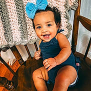Olive joined the competition — help win amazing prizes! baby, baby_clothing, barefoot, blanket, bow, cheerful, child, furniture, hair_bow, happy, home, indoor, infant, knitted_blanket, navy_outfit, photography, portrait, sitting, smiling, wooden_chair