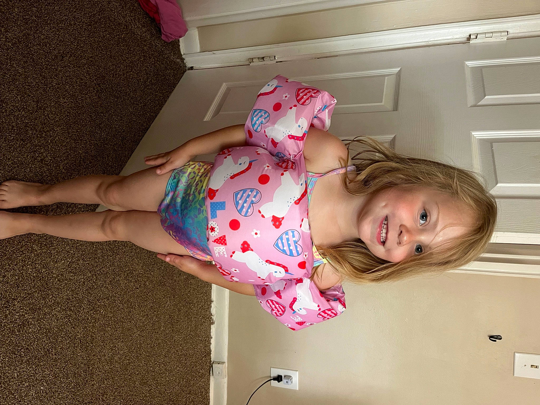 Amara joined the competition — help win amazing prizes! baby_toddler_clothing, child, comfort, door, elbow, flooring, fun, happy, human_leg, joy, knee, light_switch, magenta, pattern, person, pink, room, sleeve, smile, sock