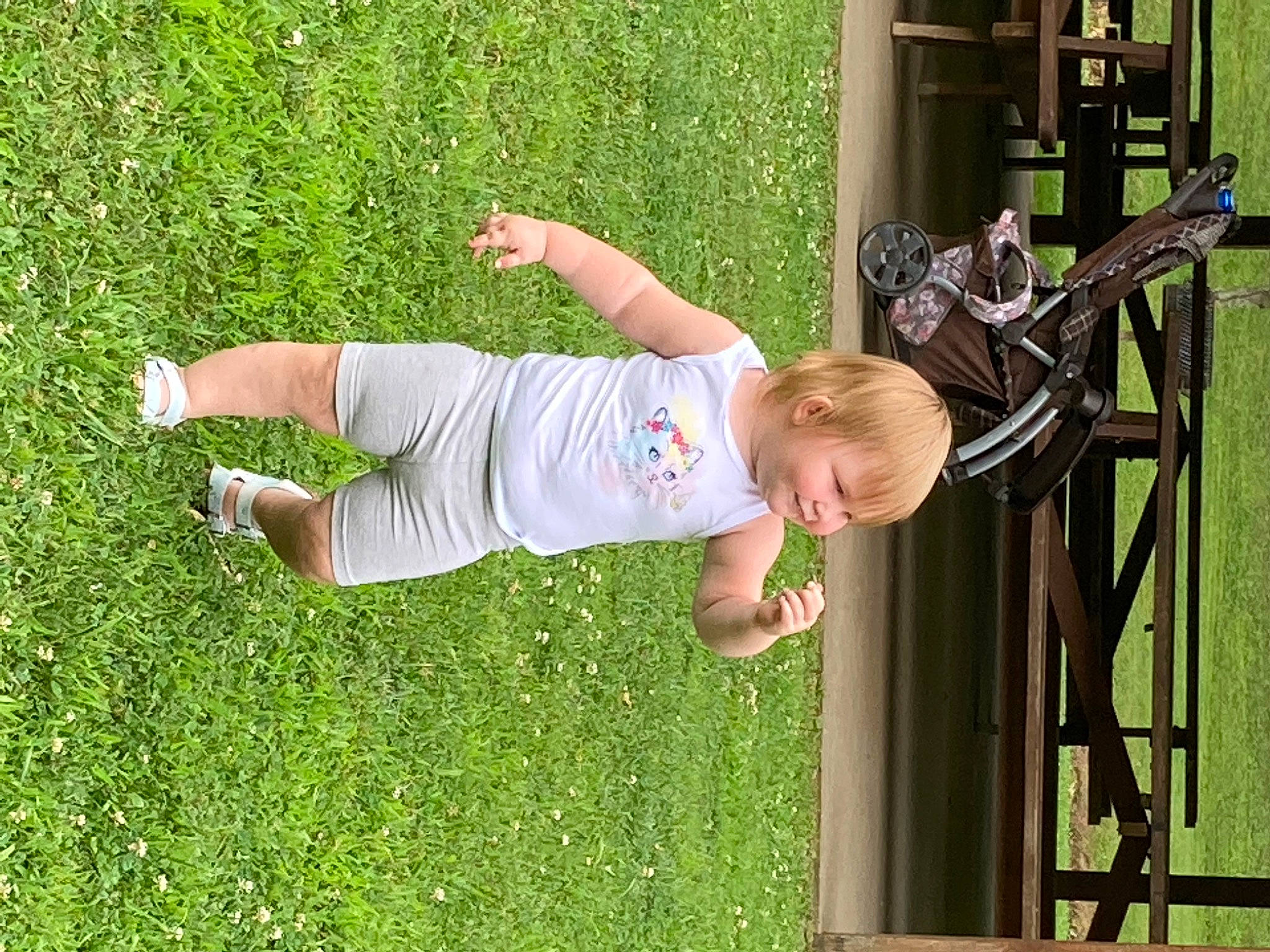 Crystal is registered to the contest to win money with this photo: baby, baby_toddler_clothing, child, fun, grass, green, happy, joy, lawn, leisure, mammal, outdoor_play_equipment, people_in_nature, person, plant, recreation, smile, t_shirt, toddler, tree