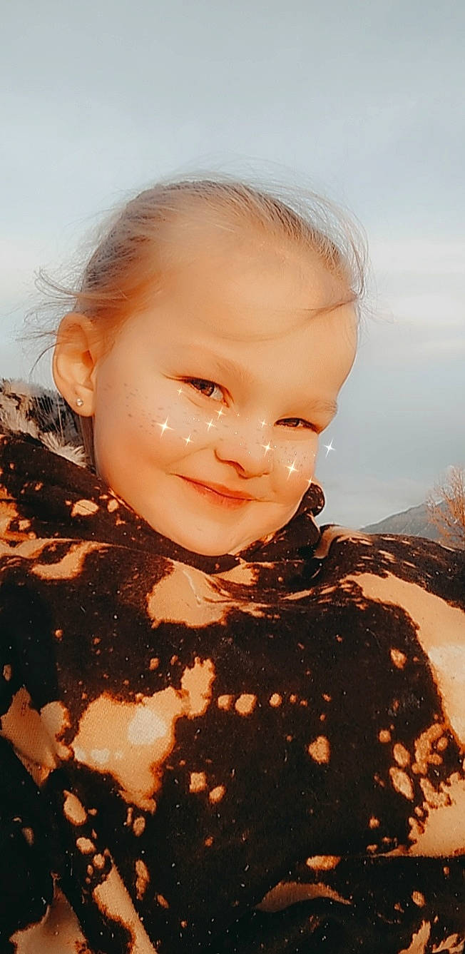 Raina is registered to the contest to win money with this photo: art, cheek, child, chin, cool, eyebrow, flash_photography, forehead, fun, hairstyle, happy, iris, jaw, joy, lip, neck, people_in_nature, person, sky, sleeve