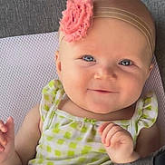 Kolbie joined the competition — help win amazing prizes! baby, child, smile, headband, flower, blue_eyes, green_dress, checkered_pattern, infant, cute, portrait, closeup, hand, skin, face, happy, sitting, indoors, texture, fabric