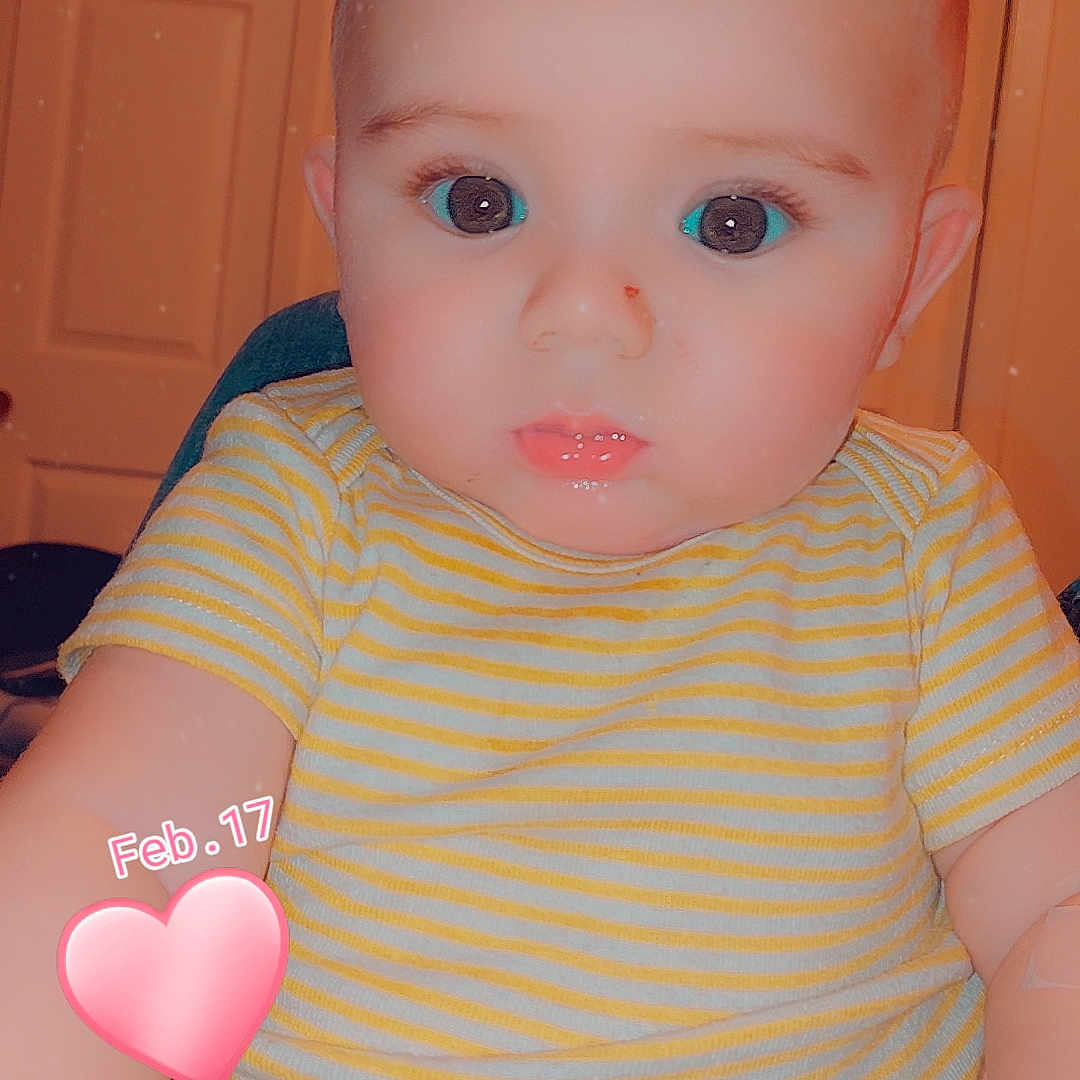 Jordan is registered to the contest to win money with this photo: applique, baby, balloon, birthdaycake, bodypart, cake, clothing, couch, face, finger, food, furniture, hand, head, pattern, person, photography, portrait, sweets, t_shirt